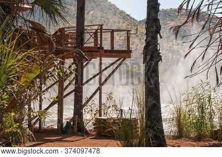 Epupa, Namibia - May 26, 2011: Deck Of A Restaurant And A Camping Site At The Top Of The Epupa Water