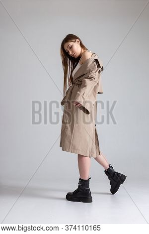 Attractive Caucasian Skinny Girl With Long Hair Posing On White Cyclorama. Beauty Portrait, Model Te