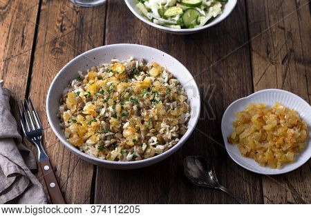 Traditional Middle Eastern Dish, Mujadara Of Lentils, Rice And Fried Onions With A Salad Of Cabbage 