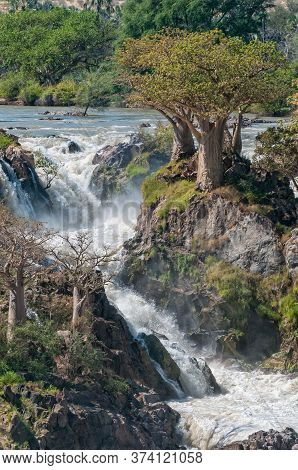 Part Of The Epupa Waterfalls In The Kunene River. Baobab Trees Are Visible
