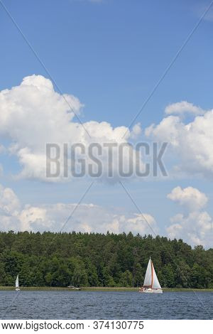 Masuria, Poland - June 24, 2020 : Lake In Polish Masuria, Sailing Yachts On A Sunny Day