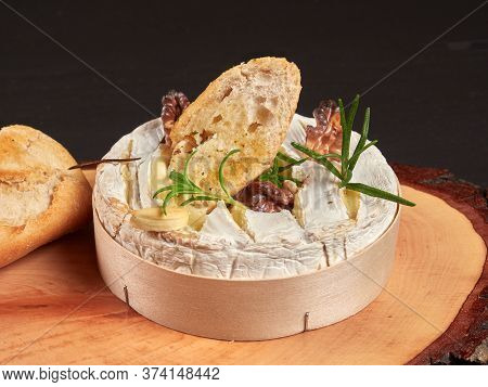 Baked Camembert With Walnuts, Rosemary Stalks And Garlic Cloves, Served With Crusty Garlic Gread, On
