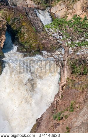 Part Of The Epupa Waterfalls In The Kunene River. A Baobab Tree Is Visible