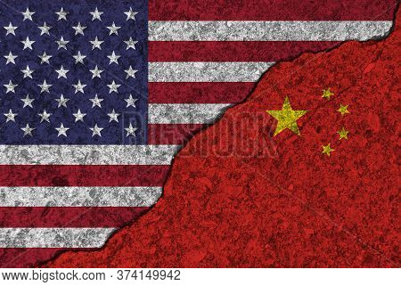 Cracked Painted Concrete Walls Between Usa Flag And China. Concept Of Conflict Or Bad Relationship.