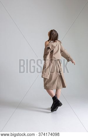 Attractive Caucasian Skinny Girl With Long Hair Posing On White Cyclorama. Beauty Portrait, Model Te