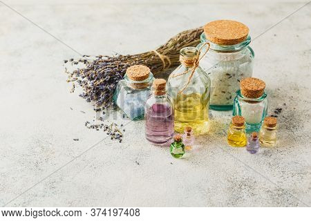 Aromatic Oils In Glass Bottles, Aromatic Salts And Dry Lavender. Concept Natural Ogranic Skincare Co
