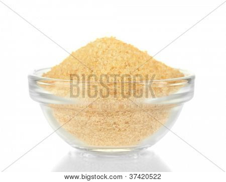Crystals of gelatin in a bowl isolated on white close-up
