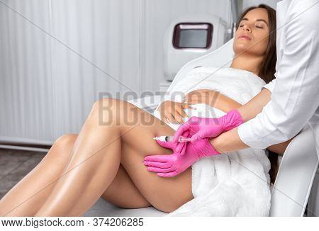 Aesthetic Cosmetologist Makes Lipolytic Injections To Burn Fat On The Thighs, Hips And Body Of A Wom