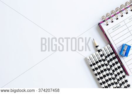 Weekly Organizer Planner, Shaper And Sharp Pencil Surrounded By Dull Pencils. Stationery Flat Lay. B