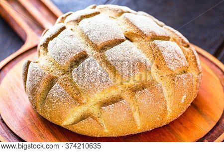 Small Homemade Bread, Biscuit Called Broa Or Broinha, Bread Made From Corn, On A Rustic Wooden Backg