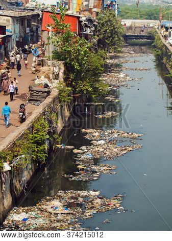 Mumbai, India - December 17, 2018: Dirty River In Dharavi Slums. Mumbai. India.