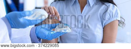Doctor Offers Girl Choice Silicone Breast Implants. Plastic Surgeon Offers Breast Implant Based On H