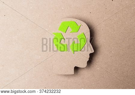 Head Profile Silhouette With Recycle Symbol On Brown Paper Background. Ecology Thinking.