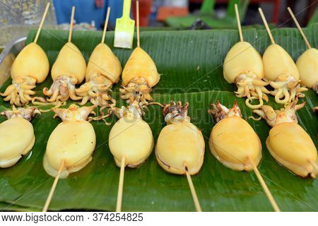 Squid Carapace, Skewers Placed On A Green Banana Leaf For Sale