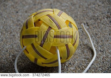 Yellow Sepak Takraw On Concrete Background  Sport Outdoor