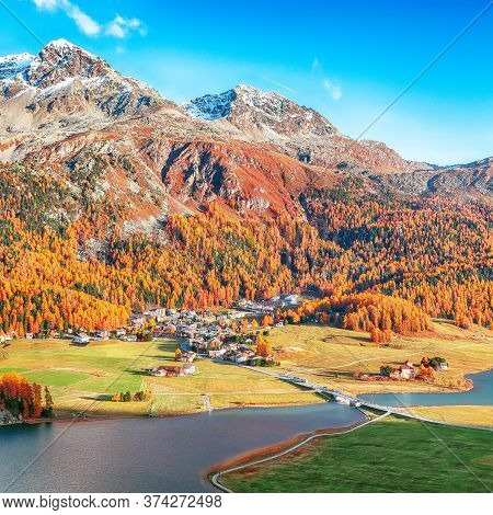 Awesome Autumn Panorama Of Silvaplana Lake And Surlej Village. Location: Silvaplana, Maloya District