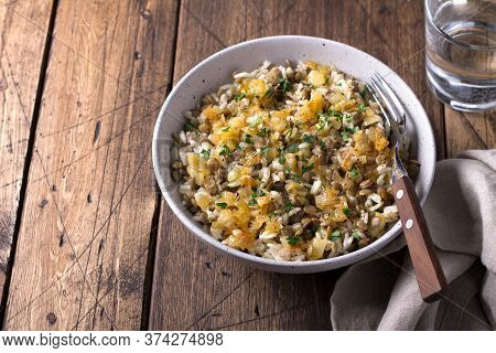 Traditional Middle Eastern Dish, Mujadara Of Lentils, Rice And Fried Onions On Wooden Table, Top Vie