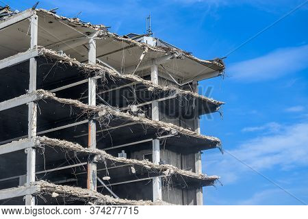 Building House Demolition Site Excavator With Hydraulic Crasher Machine And Yellow Container