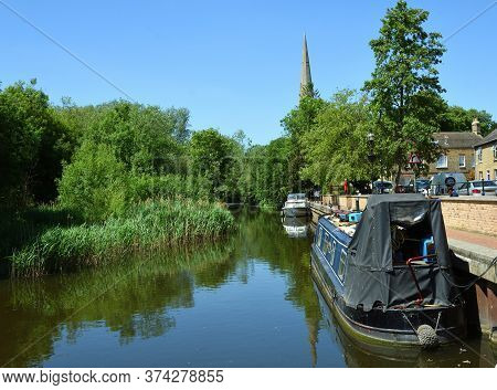 St Ives, Cambridgeshire, England - May 28, 2020: St Ives Old River Port, All Saints Church And Holt 