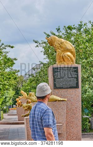 Tyumen, Russia - 24 2020: Tourist Walking Through The Square Of Siberian Cats. Animals Went From Sib