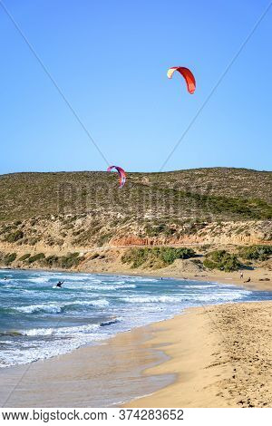 Prasonisi Beach With Kitesurfers Surfing In Waves (rhodes, Greece)
