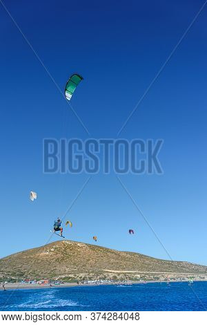 Kitesurfer In Big Jump In Air On Prasonisi Beach (rhodes, Greece)