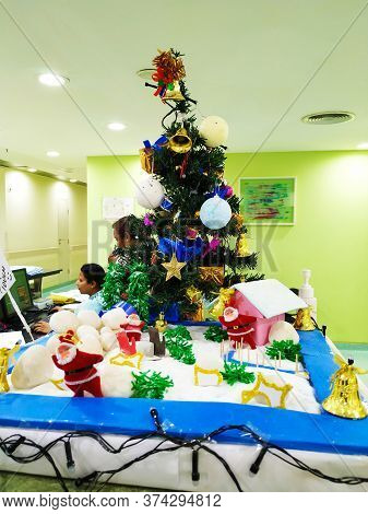 Beautiful View Of Christmas Tree Decoration With Bell, Gift Box And Star. Done At Entrance Of Columb
