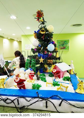 Beautiful View Of Christmas Tree Decoration With Bell, Gift Box And Star. Done At Entrance Of Columb