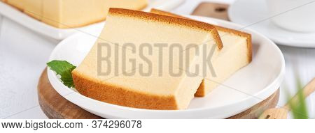 Castella (kasutera) - Beautiful Delicious Japanese Sliced Sponge Cake Food On White Plate Over Rusti