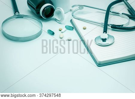 Medical Headphones With Medicine And Notebook On The Vintage Style,magnifying Glass,copy Space