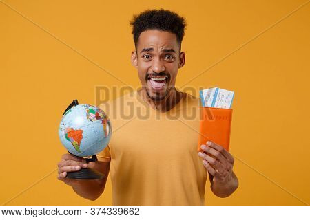 Joyful Young African American Guy In Casual T-shirt Posing Isolated On Yellow Orange Wall Background