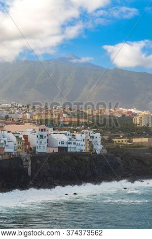 View On Ocean Shore And Colorful Buildings On The Rock In Punta Brava, Puerto De La Cruz, Tenerife, 