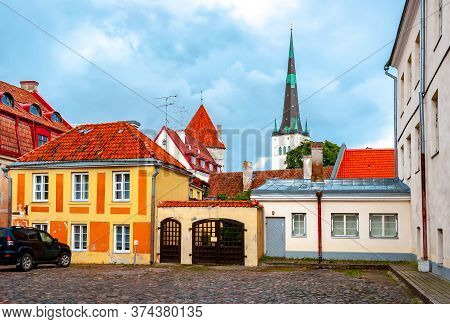 Tallinn Old Town Streets With St. Olaf's Church (oleviste Kirik) At Background, Estonia
