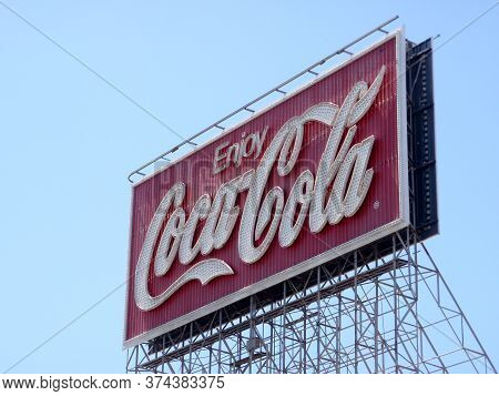 San Francisco - June 29, 2009: Enjoy Coca-cola Neon Sign During The Day Against A Blue Sky.  The Dis