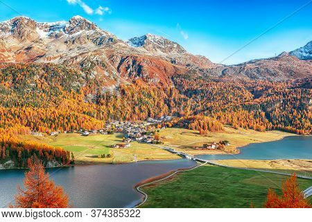 Awesome Autumn Panorama Of Silvaplana Lake And Surlej Village. Location: Silvaplana, Maloya District
