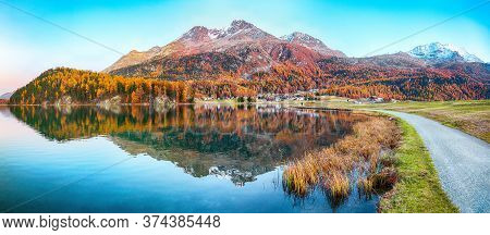 Stunning Autumn Panorama Of Silvaplana Lake And Surlej Village.  Mirror Reflaction In Lake. Location