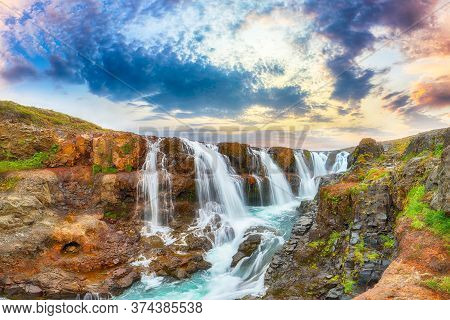 Breathtaking View Of  Kolufossar Waterfall At Sunset.  Popular Tourist Travel Destination In Iceland