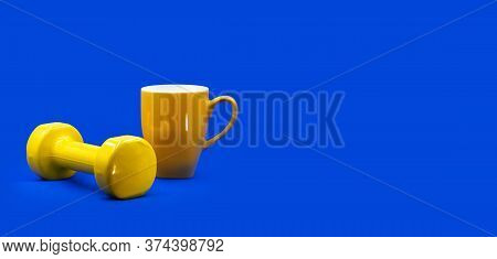 Home Workout Self Isolation Gym Online Sport Concept. A Yellow Dumbbell, Tea Cup On Contrast Vibrant