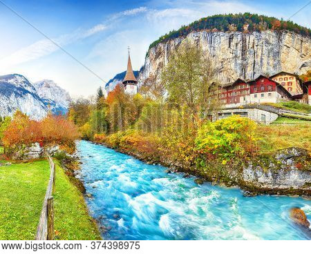 Stunning Autumn View Of Lauterbrunnen Village With Awesome Waterfall  Staubbach  And Swiss Alps In T