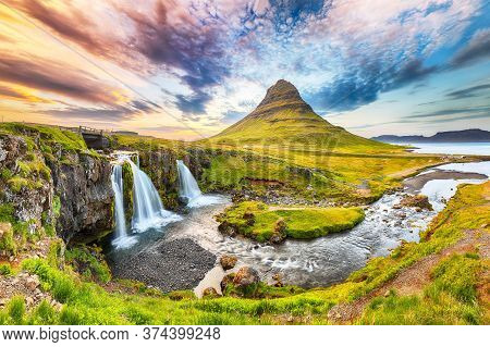 Fantastic View On Kirkjufellsfoss Waterfall  Near Kirkjufell Mountain At Sunset.  Location: Kirkjufe