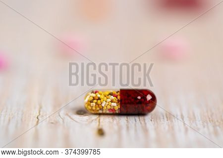Home Therapy. One Red Clear Capsule Of Microgranules