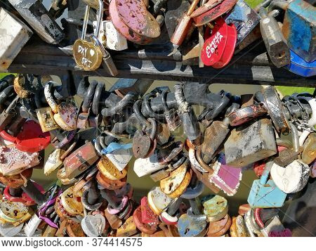 Multi-colored Wedding Locks On The Railing Of The Bridge Over The Vitba River, In The City Of Vitebs