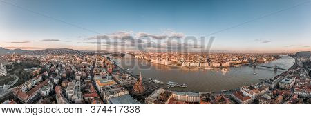 Wide Panorama Aerial Drone View Of Parliament By Danube River In Budapest Sunset
