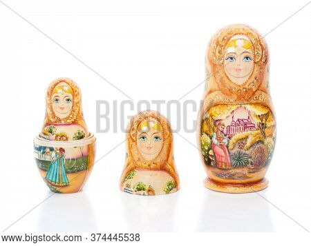 Group of Russian nesting dolls (also named as Matrioshka) isolated over white background. Wooden doll souvenir.