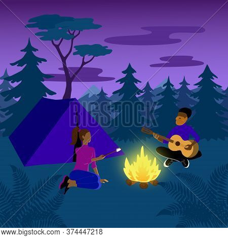 Summer Vacation In A Forest Campsite With A Tent. Man Plays Guitar And Woman Roasts Marshmallows Ove