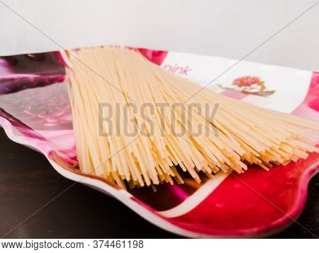 Semiya Taken In A Plate For Making Semiya Payasam.semiya Is In Long Stranded Shape And Placed On A T
