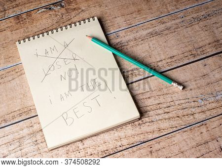 A Notebook And A Pencil With The Inscription Im A Loser No Im The Best. Motivating Quotations And Ph