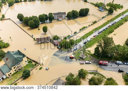 Aerial View Of Flooded Houses And Rescue Vehicles Saving People In Halych Town, Western Ukraine.