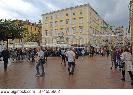 Rijeka, Croatia - October 17, 2014: People Walking At Korzo Street At Rainy Autumn Day In Rijeka, Cr
