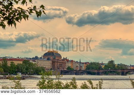 Prague National Theather From A Distance Under Clouds On A Sunny Day Of Summer